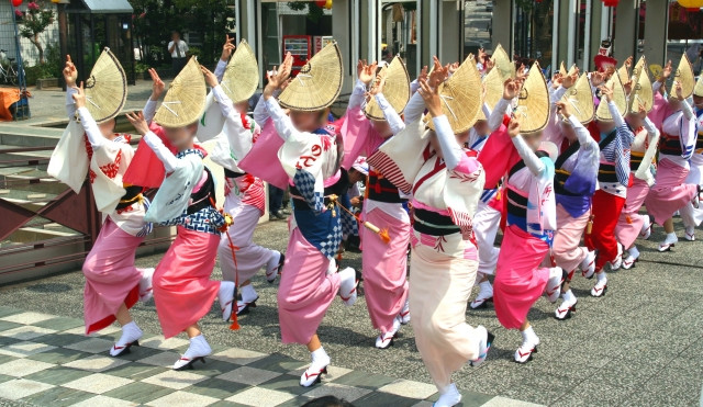 Awa Odori dancers in yukata and woven hats
