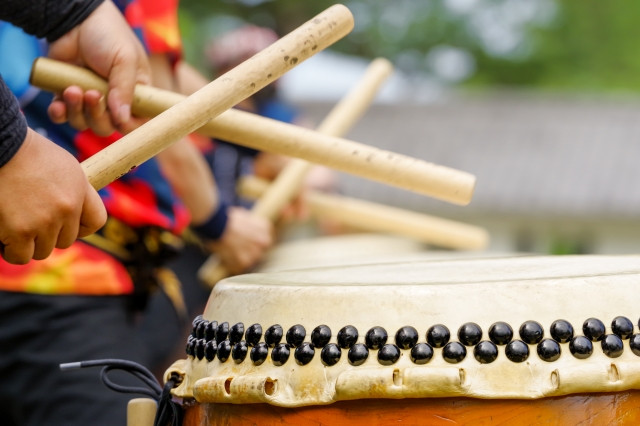 group of drummers beating taiko drums