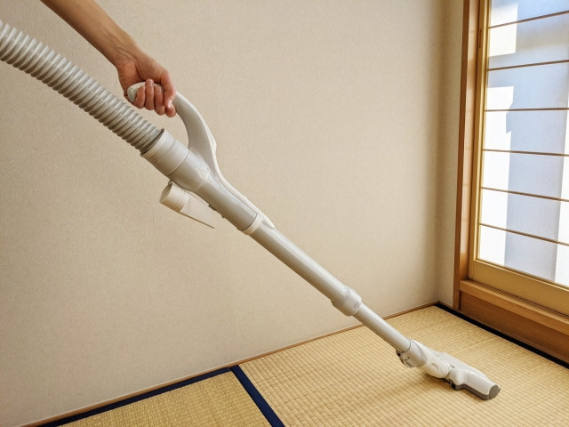 Gently vacuuming tatami floor