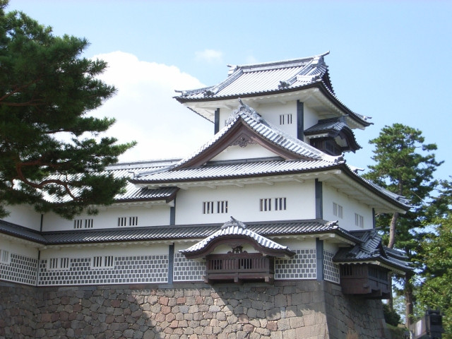 White walled blue roof tiled Yagura