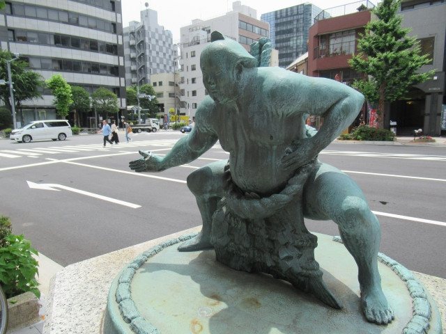 Statues of sumo fighters all around Ryogoku