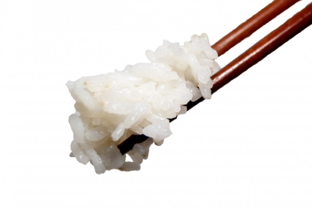 Sticky rice lifted with chopsticks
