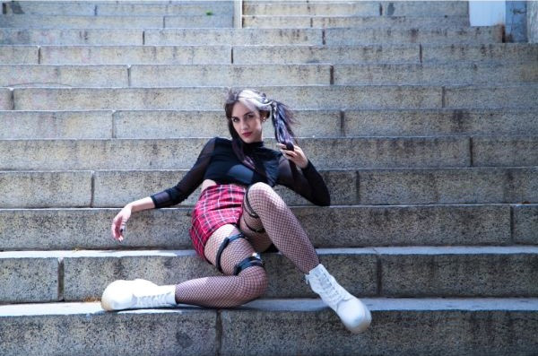 Checkered skirts and leather buckles make up the punk rock look