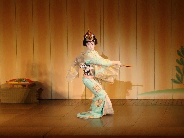 Geisha dancing in performance