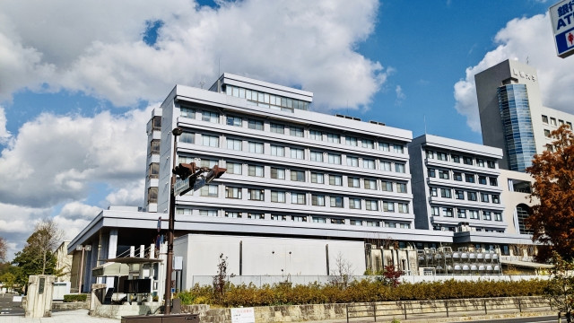Shimane University's pristine white wall building and blue skies