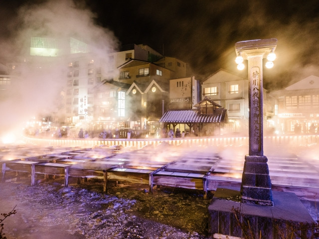 hot steam rising from kusatsu onsen's yubatake