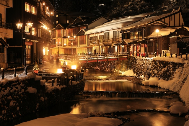 snow-covered Taisho romantic hot spring town lit by gas lamps