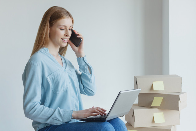 girl on the phone arranging for utilities when moving in japan