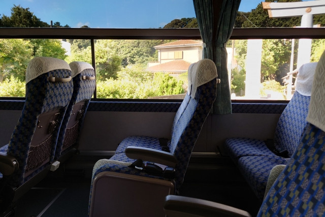 seats on a highway bus with windows of a great view